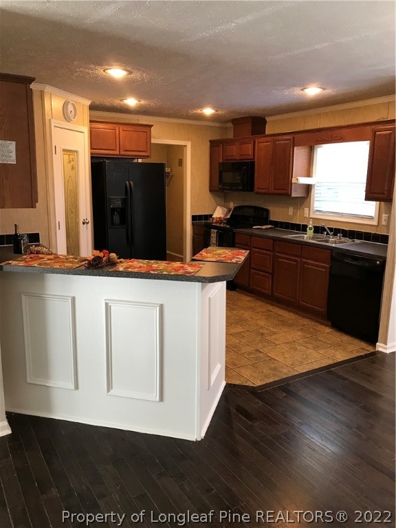 2995 Underwood Road Carthage, NC 28327 - Photo 8 of 40 a large kitchen with stainless steel appliances kitchen island granite countertop a stove a refrigerator a sink and a microwave