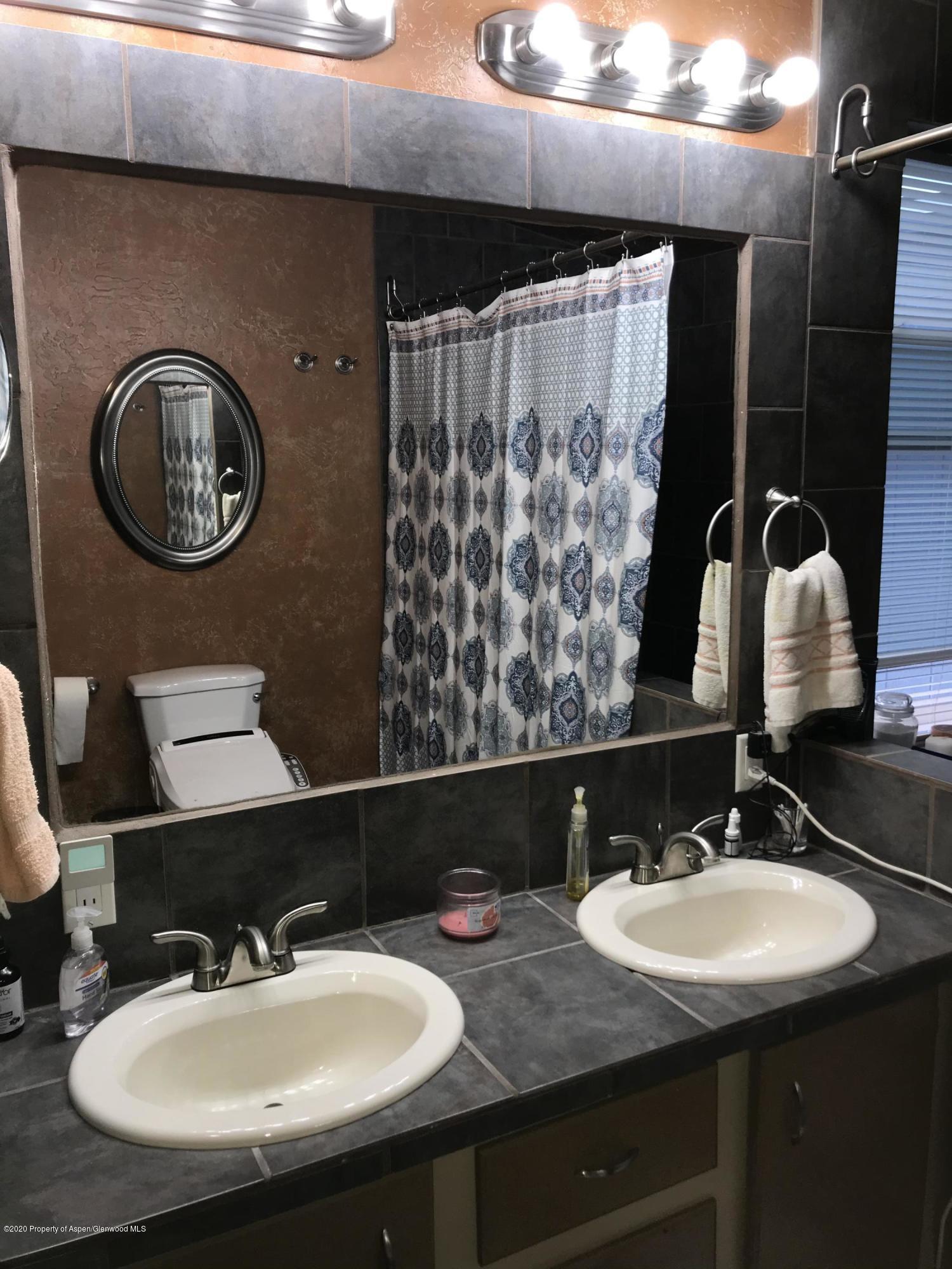 106 Cedar Circle Parachute, CO 81635 - Photo 15 of 22 a bathroom with a sink and a mirror