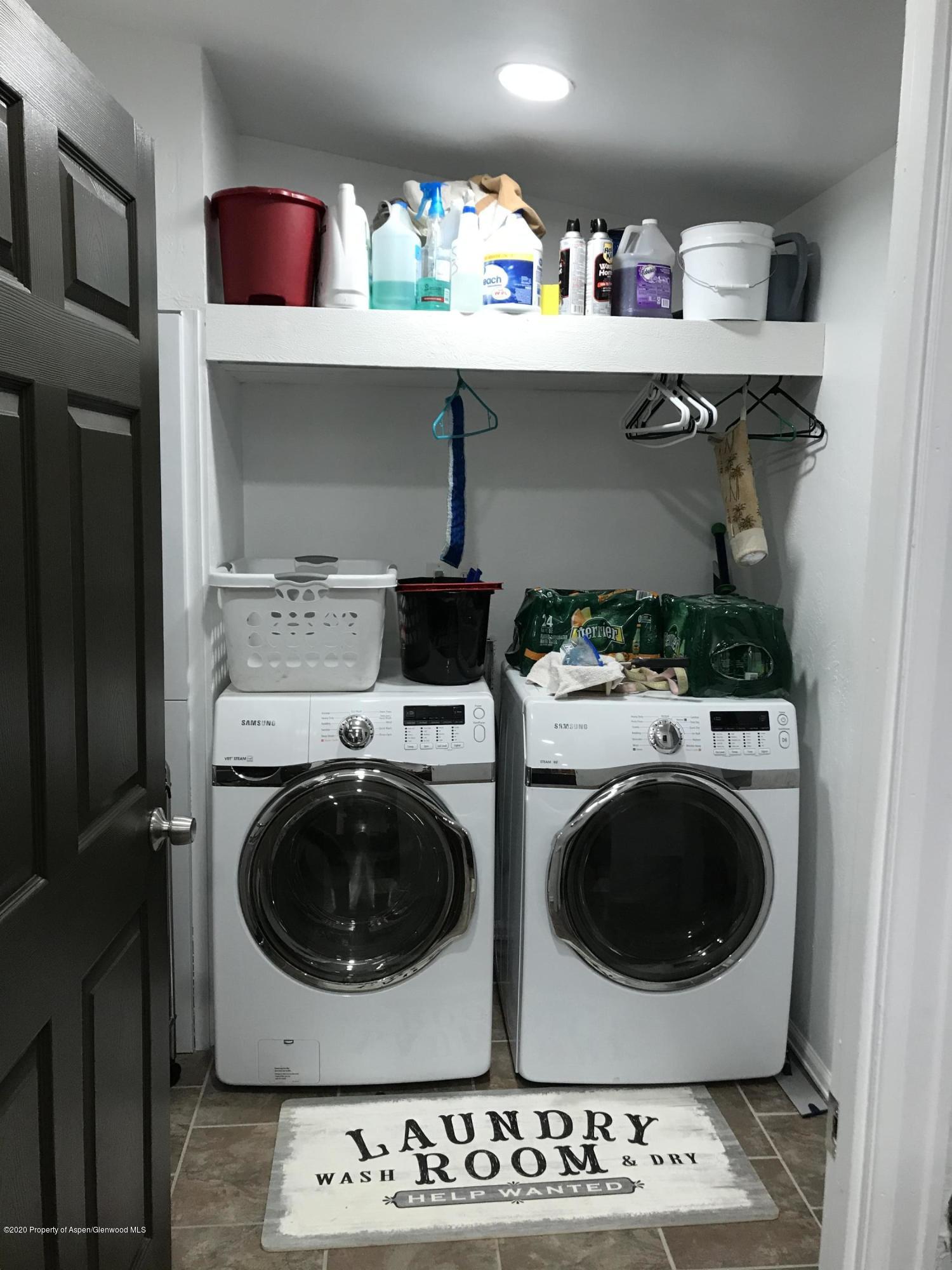106 Cedar Circle Parachute, CO 81635 - Photo 17 of 22 a utility room with dryer and washer