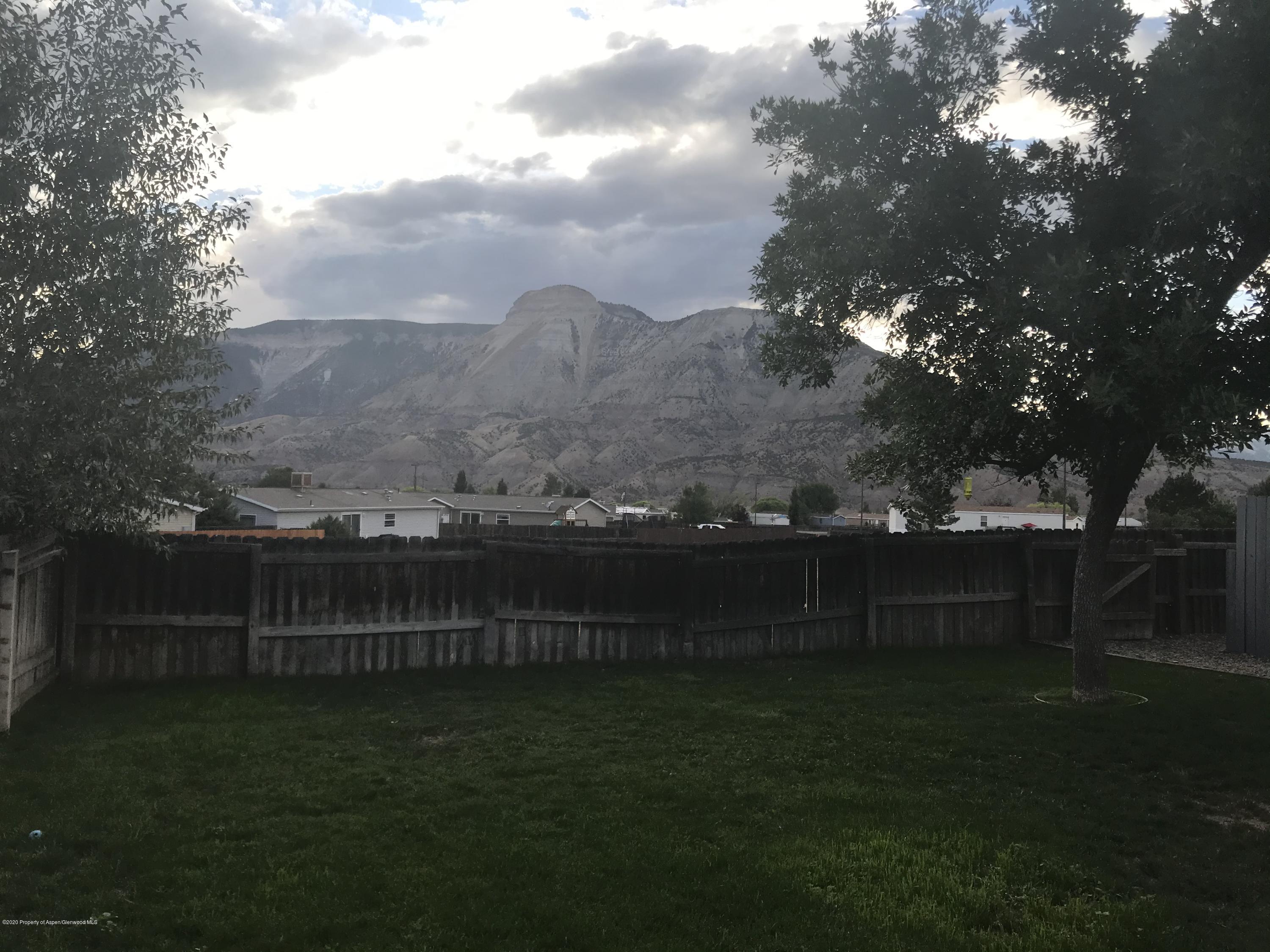 106 Cedar Circle Parachute, CO 81635 - Photo 22 of 22 a view of a yard with a lake view