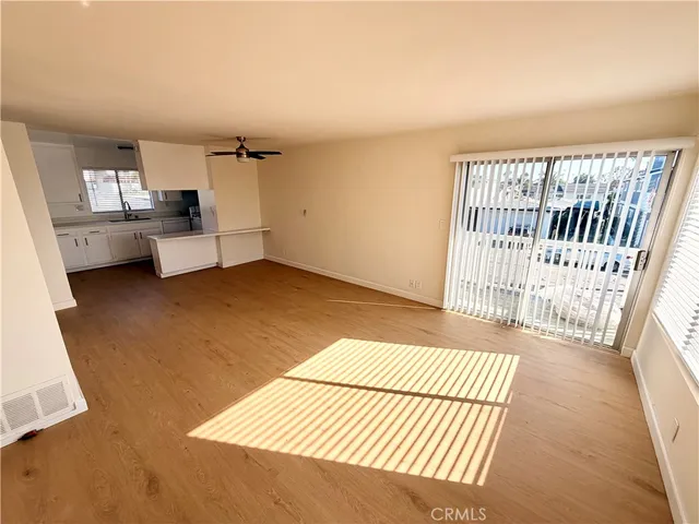 a view of a bedroom with furniture and windows