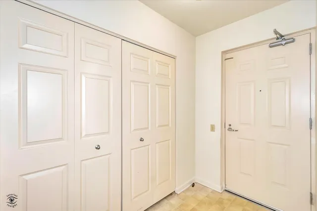 an empty room with a wooden door