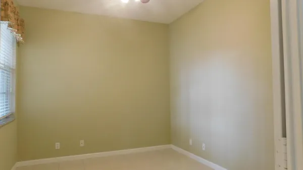 en empty room with window and outdoor view