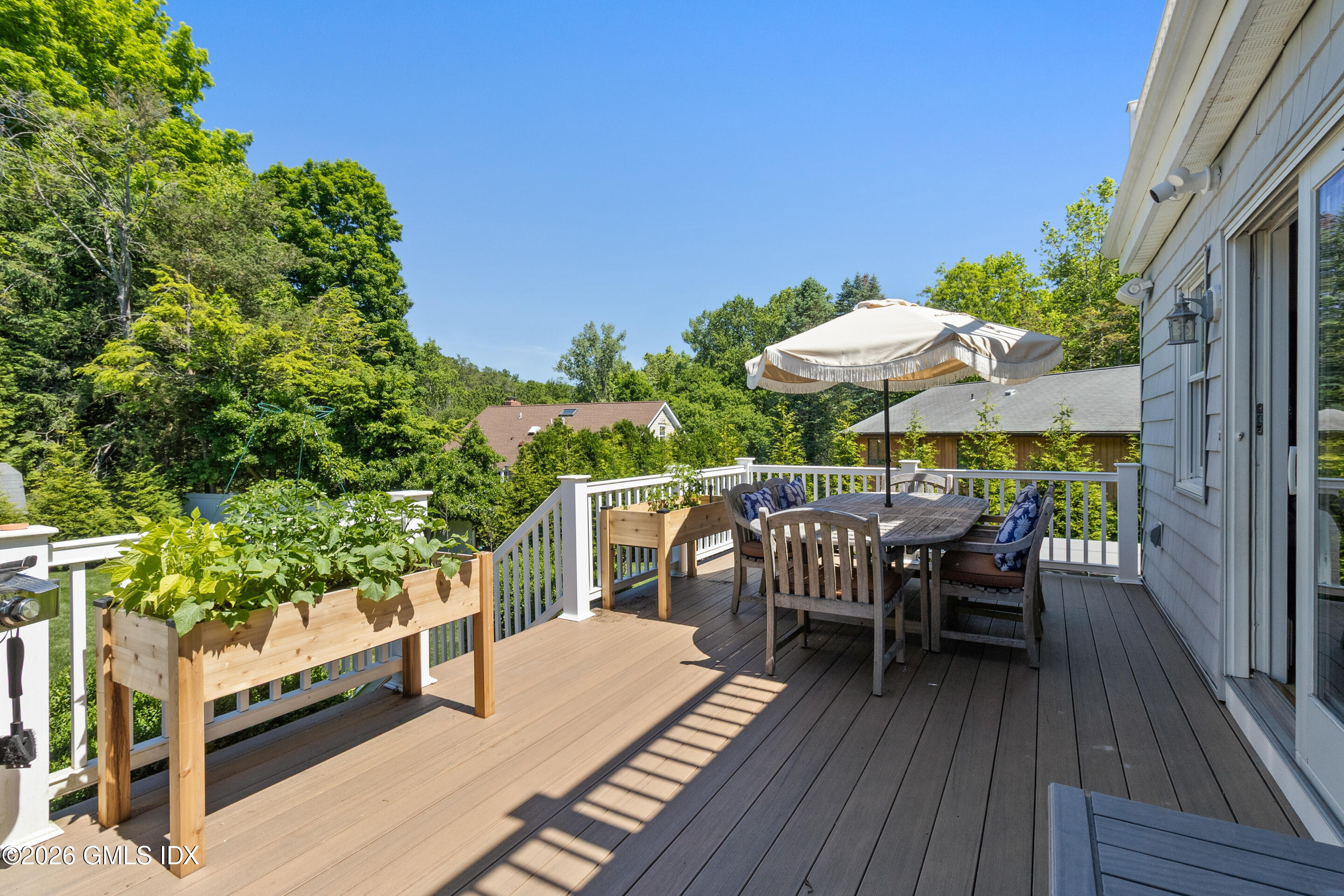 9 Deluca Drive Cos Cob, CT 06807 - Photo 24 of 30 an outdoor space with furniture and umbrella
