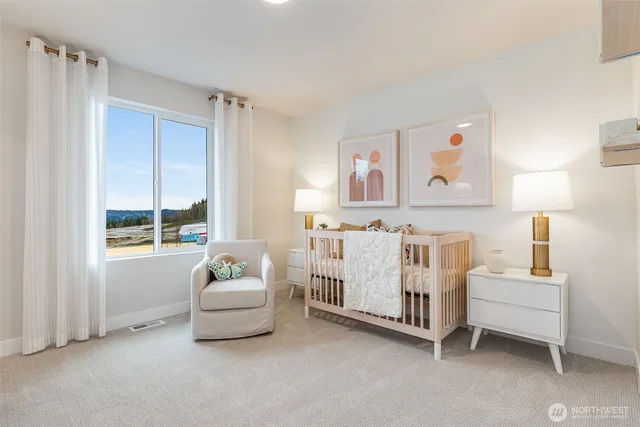 a spacious bedroom with a bed and a window