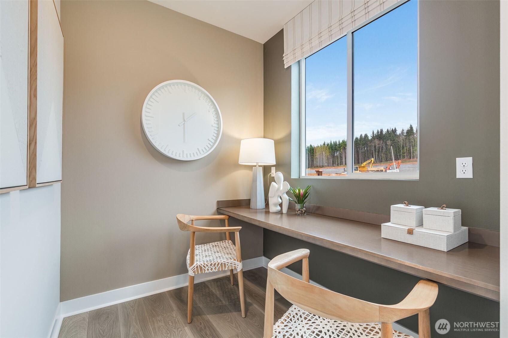23338 Arbors Ter Road Northeast, Unit 201 Kingston, WA 98346 - Photo 7 of 17 a dining room with a wooden table and chairs