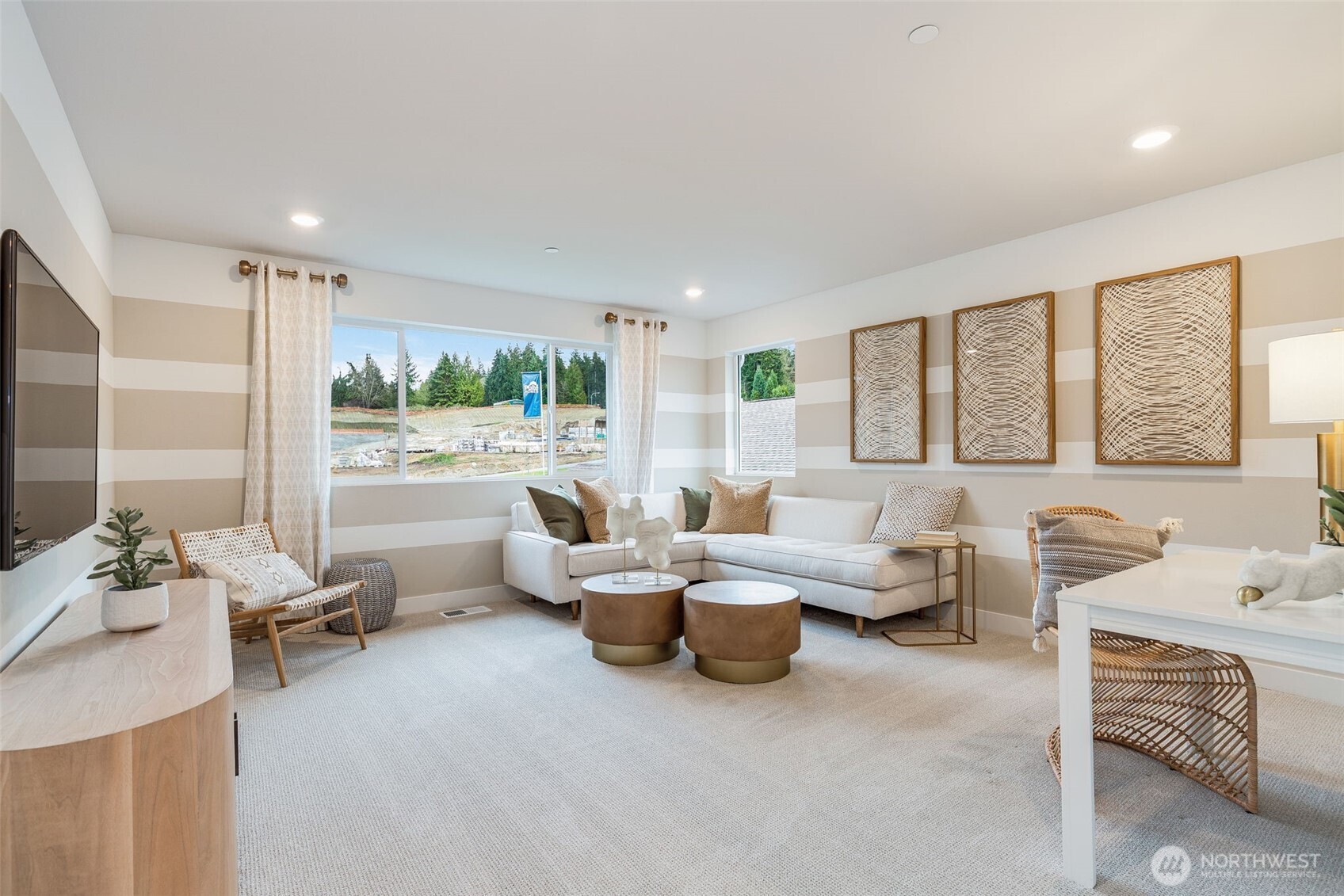 23338 Arbors Ter Road Northeast, Unit 201 Kingston, WA 98346 - Photo 8 of 17 a living room with furniture and a large window