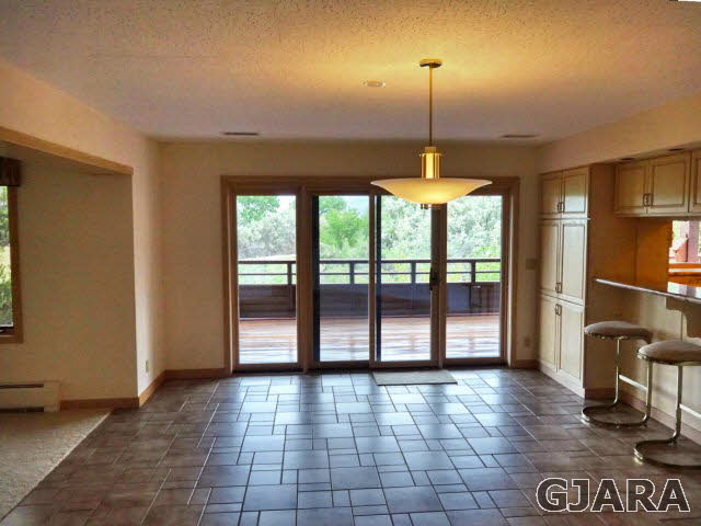 855 25 Road Grand Junction, CO 81505 - Photo 4 of 41 a view of a room with a furniture and floor to ceiling window