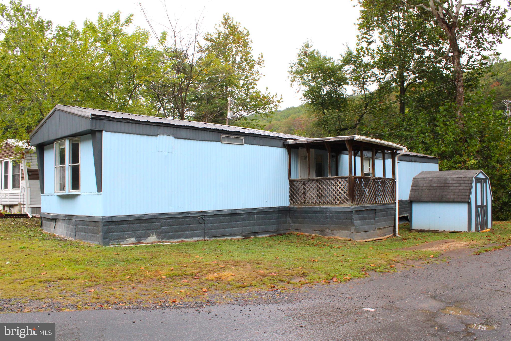 a house with swimming pool in front of it