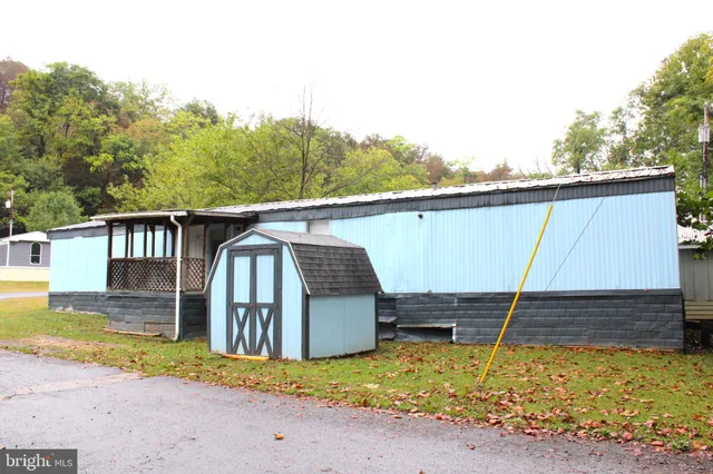 a view of a backyard with a tub