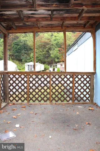 an empty room with a ceiling fan