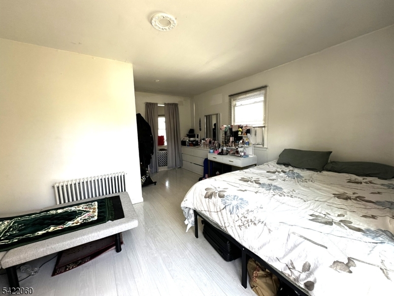 126 Bartholdi Avenue Butler, NJ 07405 - Photo 11 of 22 a bedroom with bed and window