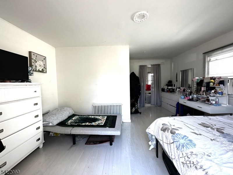 126 Bartholdi Avenue Butler, NJ 07405 - Photo 12 of 22 a living room with furniture and a flat screen tv