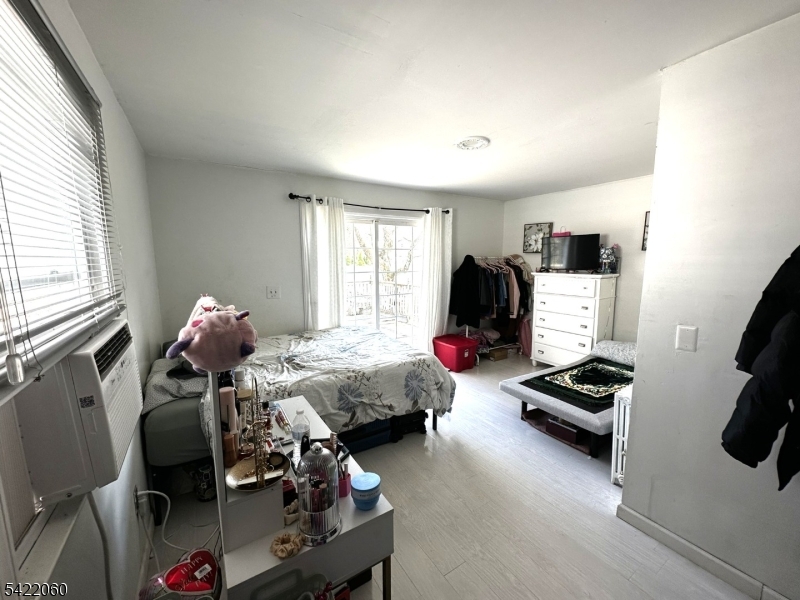 126 Bartholdi Avenue Butler, NJ 07405 - Photo 13 of 22 a bedroom with furniture and a window