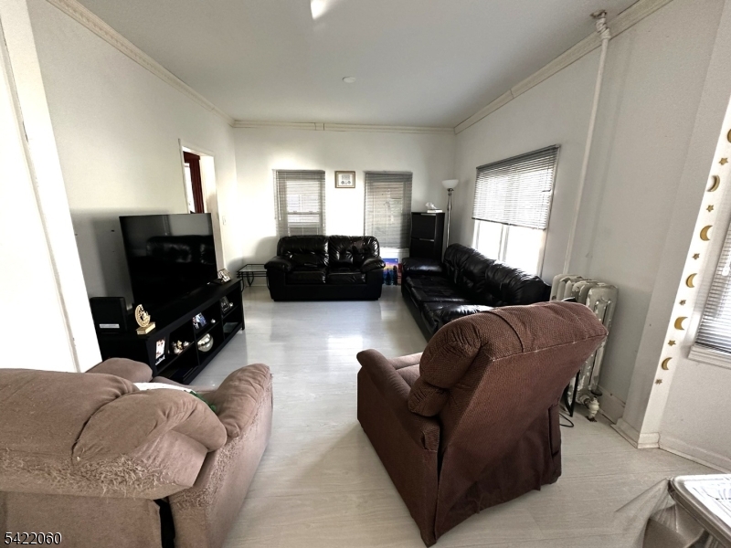 126 Bartholdi Avenue Butler, NJ 07405 - Photo 7 of 22 a living room with furniture and a flat screen tv