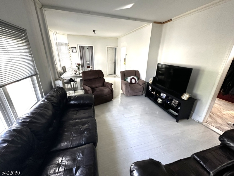 126 Bartholdi Avenue Butler, NJ 07405 - Photo 10 of 22 a living room with furniture and a flat screen tv