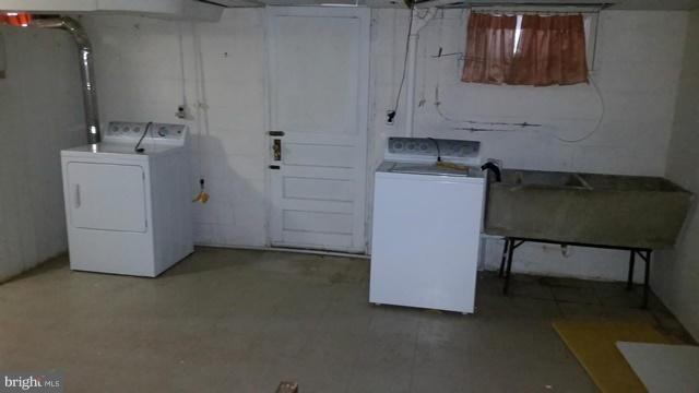 1832 Edgewood Road Baltimore, MD 21286 - Photo 13 of 13 a utility room with closet dryer and washer