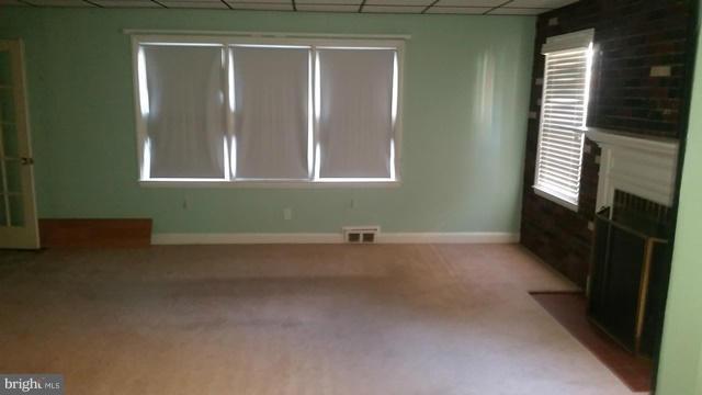 1832 Edgewood Road Baltimore, MD 21286 - Photo 6 of 13 a view of empty room with windows