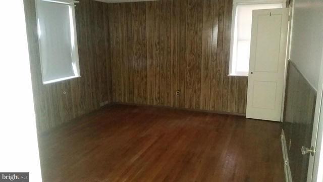 1832 Edgewood Road Baltimore, MD 21286 - Photo 7 of 13 a view of a closet area with wooden floor