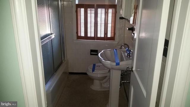 1832 Edgewood Road Baltimore, MD 21286 - Photo 10 of 13 a bathroom with a sink and toilet