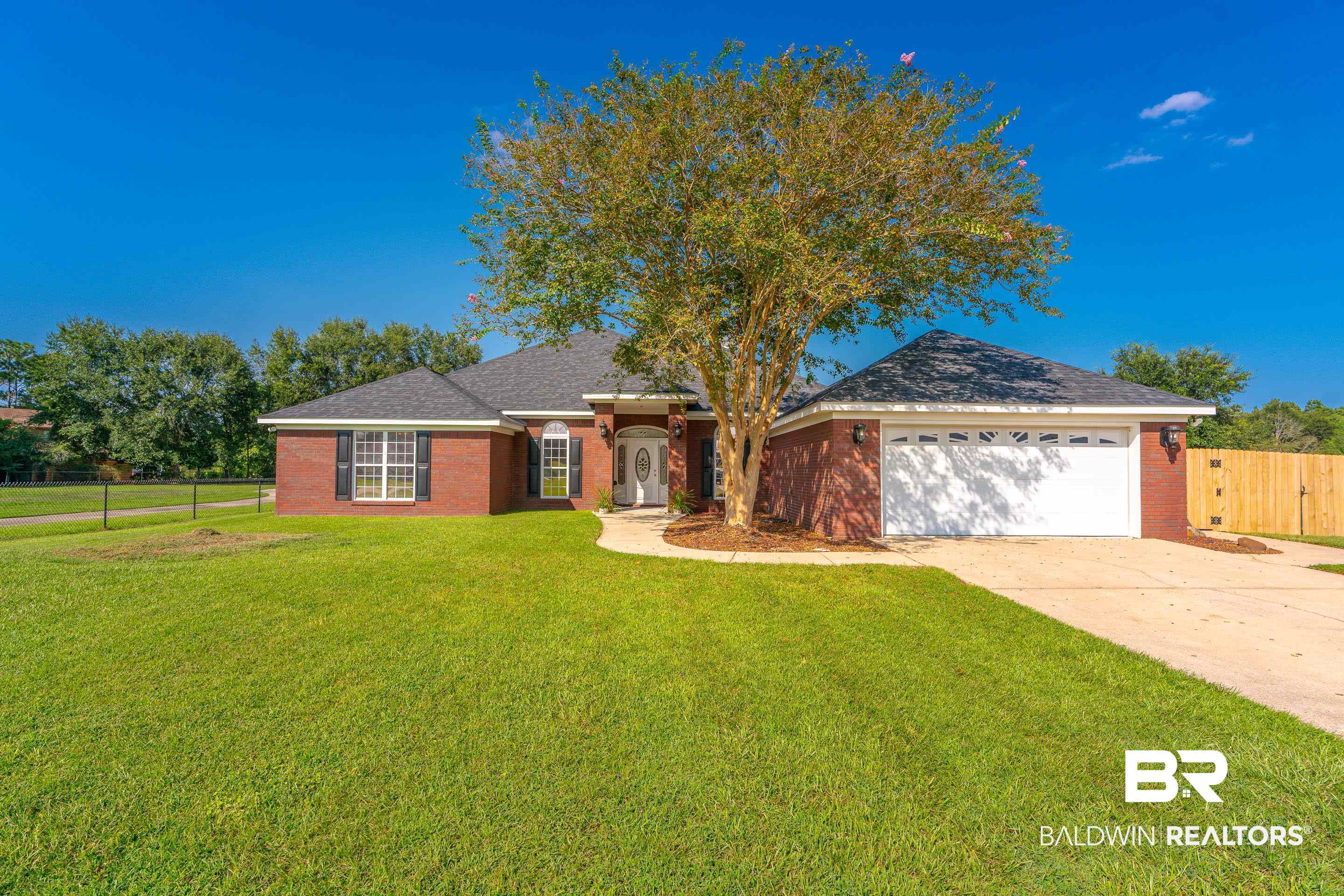 9477 Deerfield Drive Irvington, AL 36544 - Photo 51 of 58 Ranch-style home with a front lawn and a garage