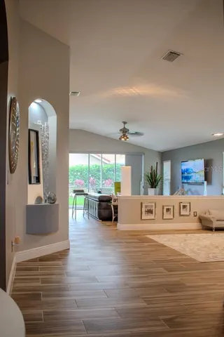 a living room with furniture and a large window