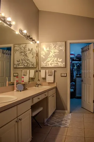 a kitchen with a sink window and refrigerator