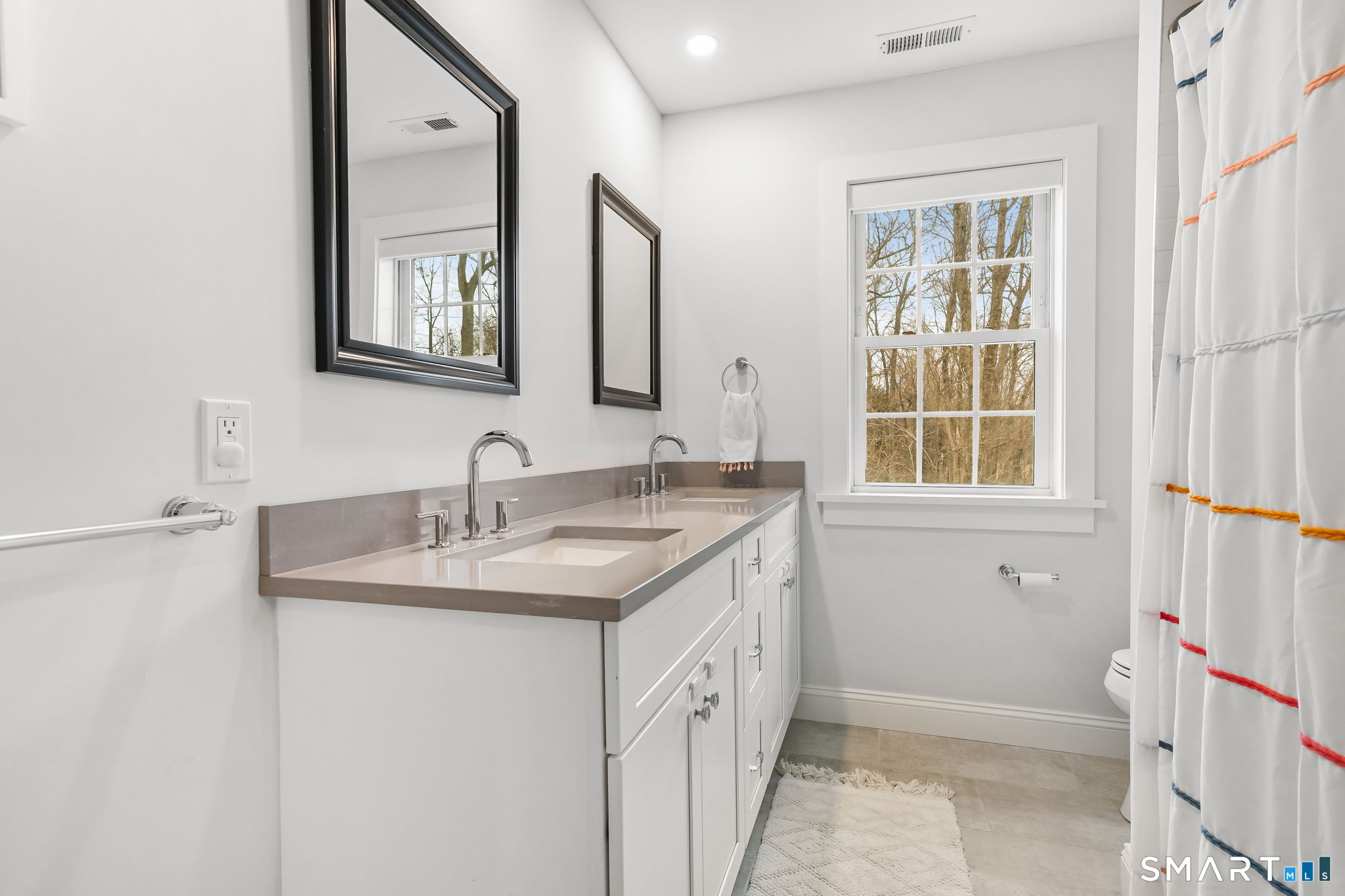 153 North Street Trumbull, CT 06611 - Photo 17 of 27 Well-appointed hall bathroom with a double vanity