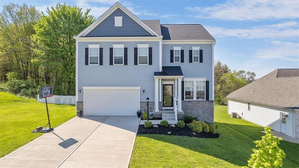 front view of a house with a yard