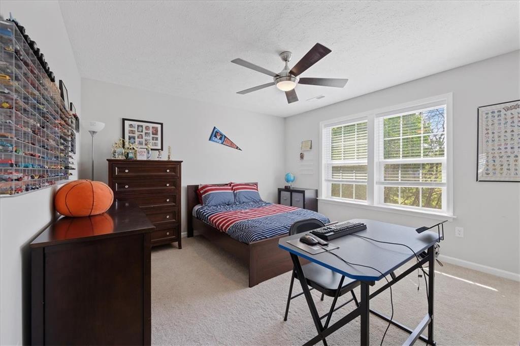 233 Wyncrest Drive Butler, PA 16001 - Photo 13 of 25 a bedroom with a bed and wooden floor