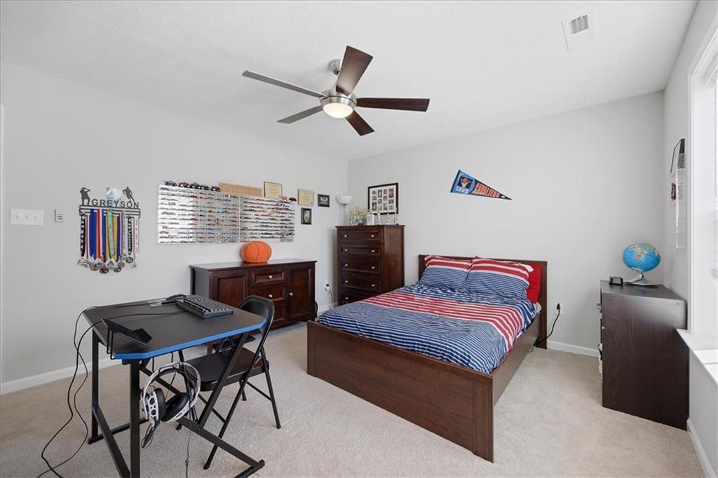 233 Wyncrest Drive Butler, PA 16001 - Photo 14 of 25 a bedroom with a bed and a desk