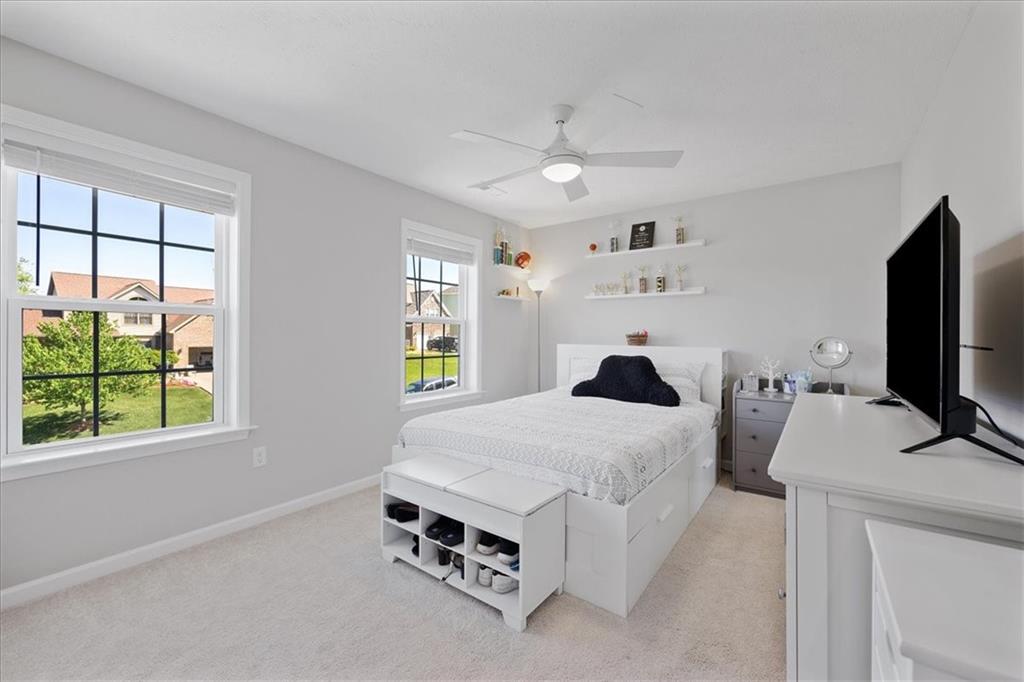 233 Wyncrest Drive Butler, PA 16001 - Photo 15 of 25 a bedroom with a bed and a flat tv screen on the dresser