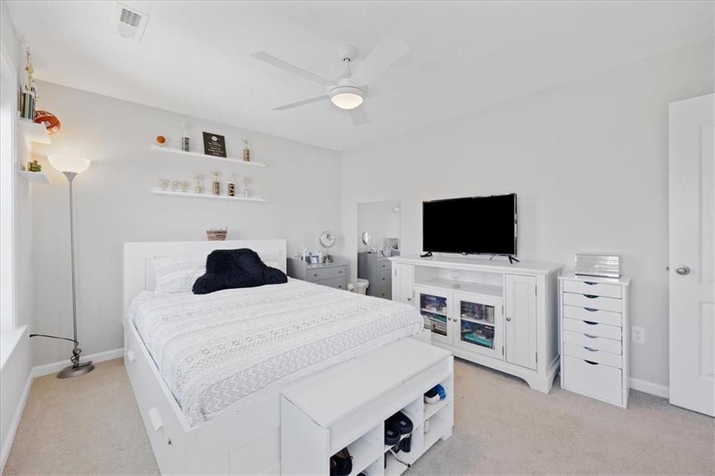 233 Wyncrest Drive Butler, PA 16001 - Photo 16 of 25 a room with a bed and a flat screen tv