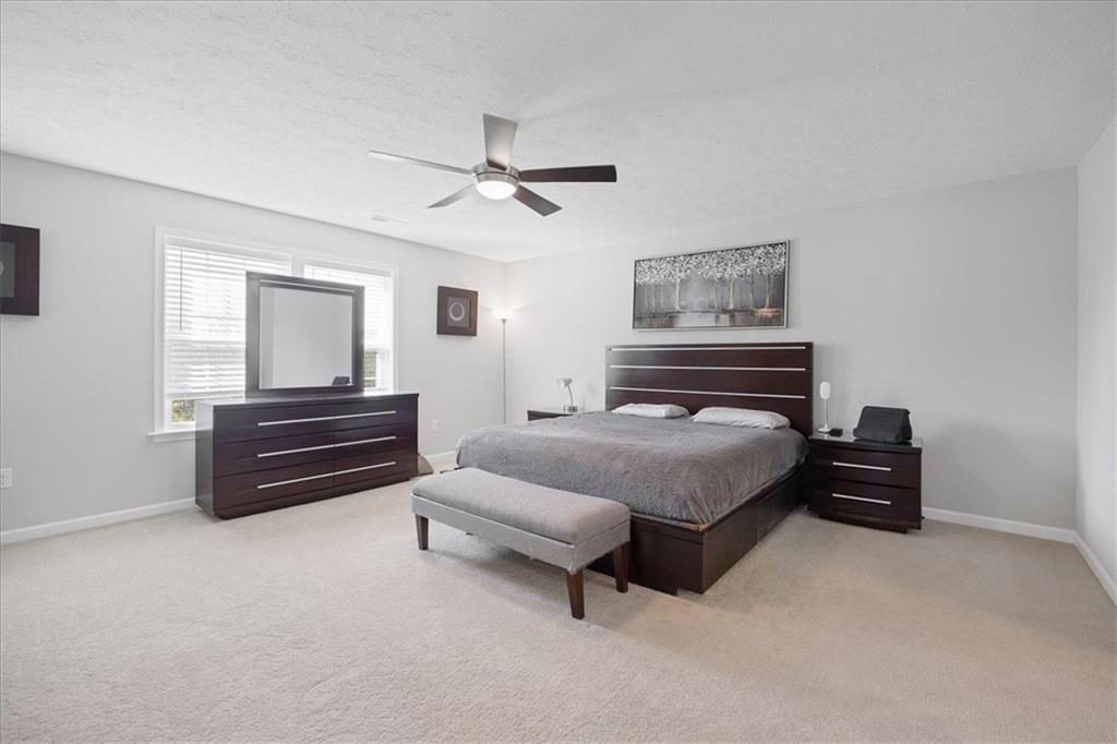 233 Wyncrest Drive Butler, PA 16001 - Photo 17 of 25 a bedroom with a bed and a chandelier