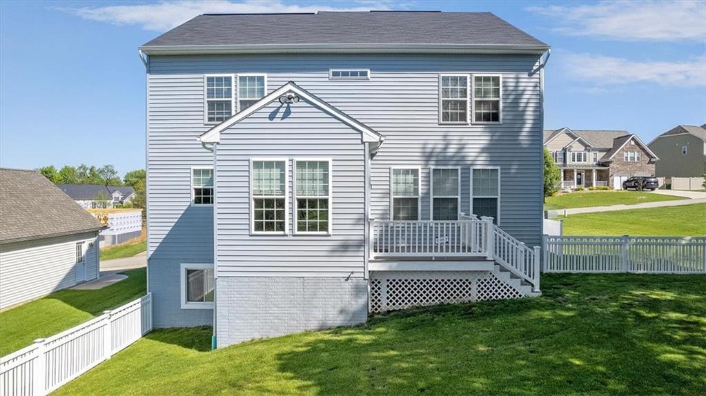 233 Wyncrest Drive Butler, PA 16001 - Photo 22 of 25 a front view of a house with a garden and yard