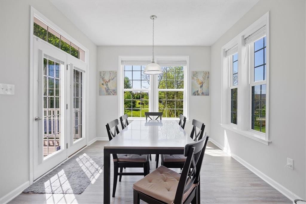 233 Wyncrest Drive Butler, PA 16001 - Photo 8 of 25 a view of a dining room with furniture window and wooden floor