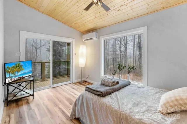 a bedroom with a bed and a desk