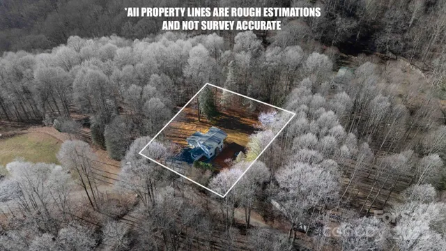 a white house with tall trees