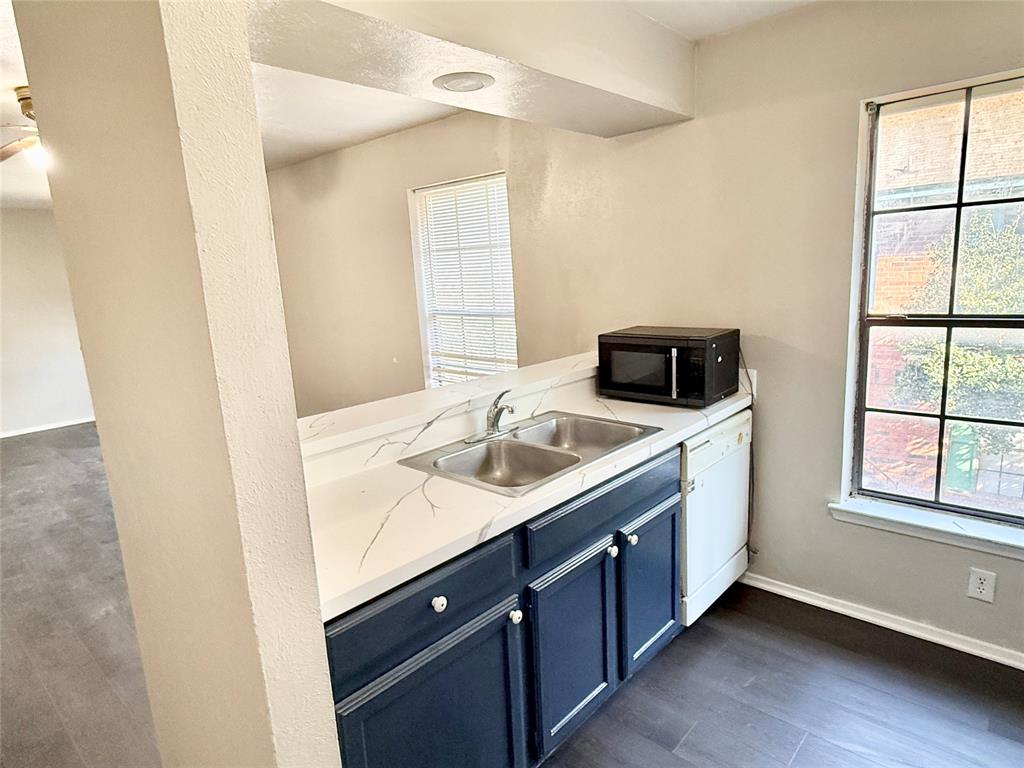 2221 Stella Street, Unit 4 Denton, TX 76201 - Photo 5 of 11 a kitchen with a sink and a window
