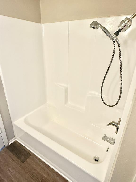 2221 Stella Street, Unit 4 Denton, TX 76201 - Photo 9 of 11 a bathroom with a bath tub and a shower