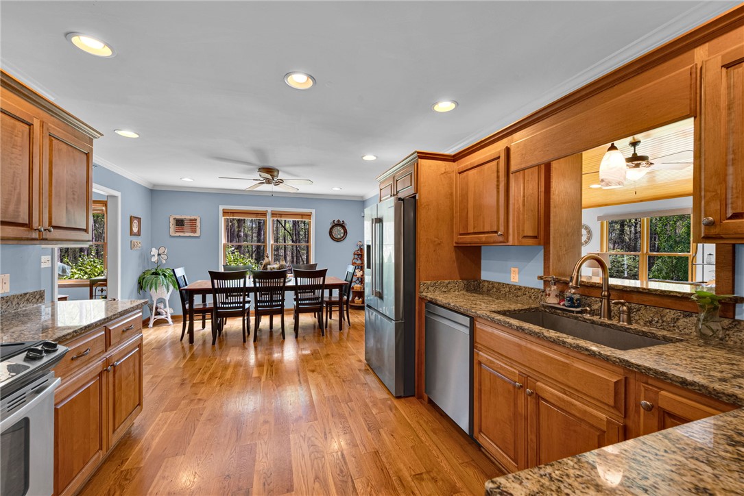 1010 Ridgeview Drive Pendleton, SC 29670 - Photo 14 of 47 This spacious kitchen and dining area features warm wood finishes and ample natural light.