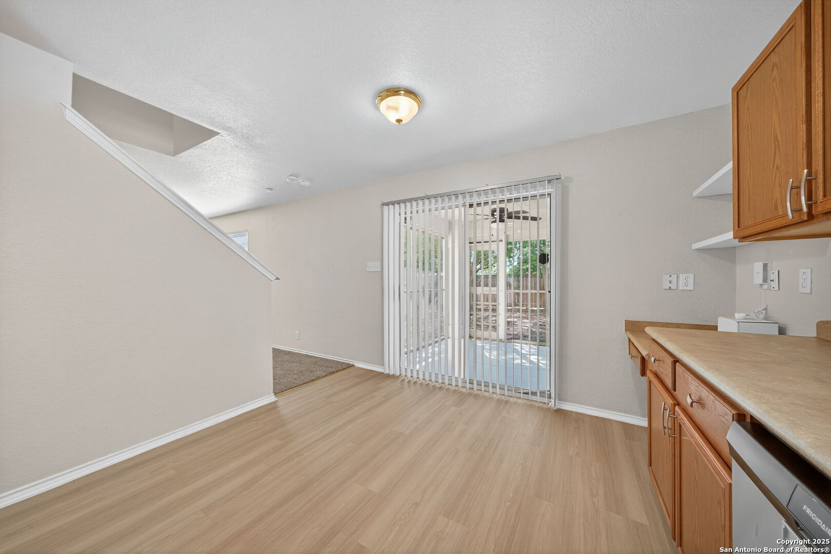 7719 Mesquite Farm San Antonio, TX 78239 - Photo 14 of 27 a view of kitchen with wooden floor and electronic appliances