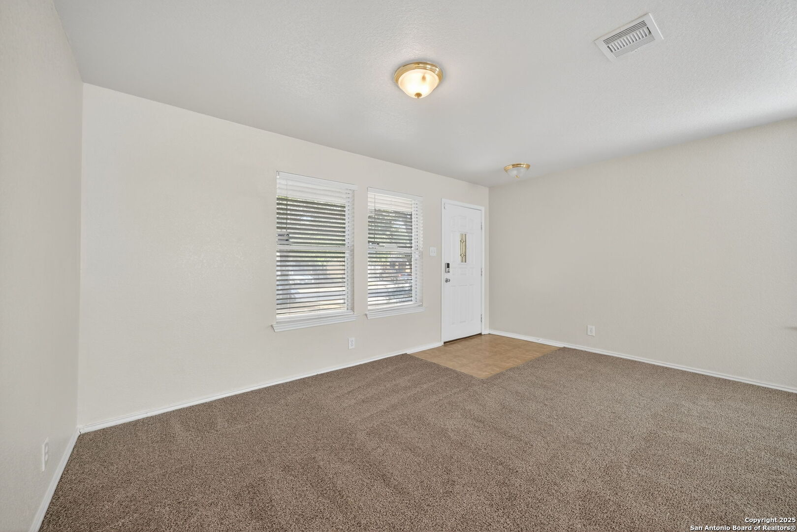 7719 Mesquite Farm San Antonio, TX 78239 - Photo 15 of 27 a view of an empty room with a window