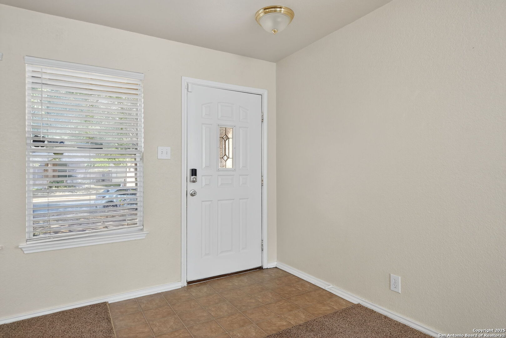 7719 Mesquite Farm San Antonio, TX 78239 - Photo 5 of 27 an empty room with windows