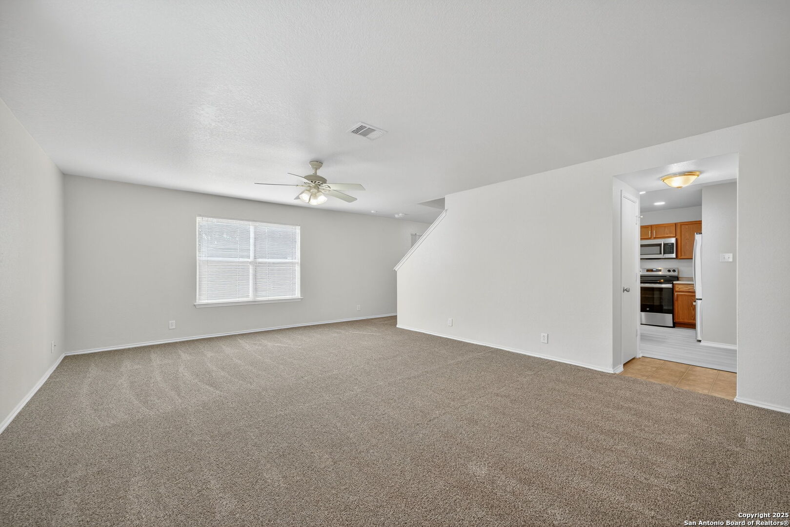 7719 Mesquite Farm San Antonio, TX 78239 - Photo 6 of 27 a view of an empty room with a window