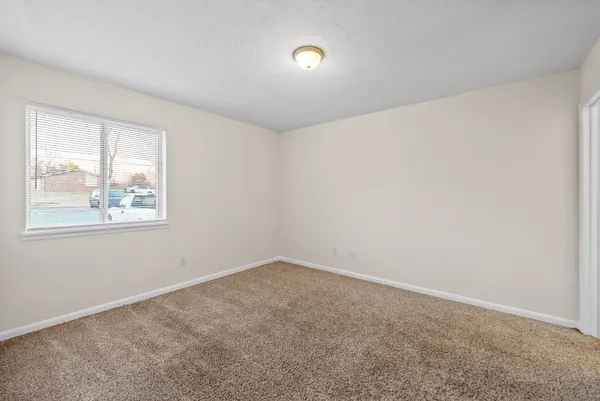 a view of an empty room and window