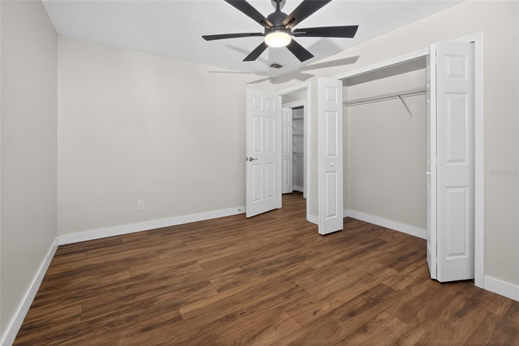 7023 Talbot Drive Orlando, FL 32819 - Photo 21 of 34 wooden floor in an empty room