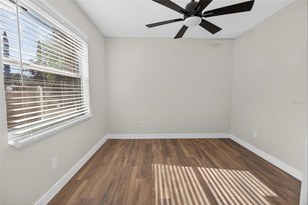 7023 Talbot Drive Orlando, FL 32819 - Photo 26 of 34 a view of a room with a window and wooden floor