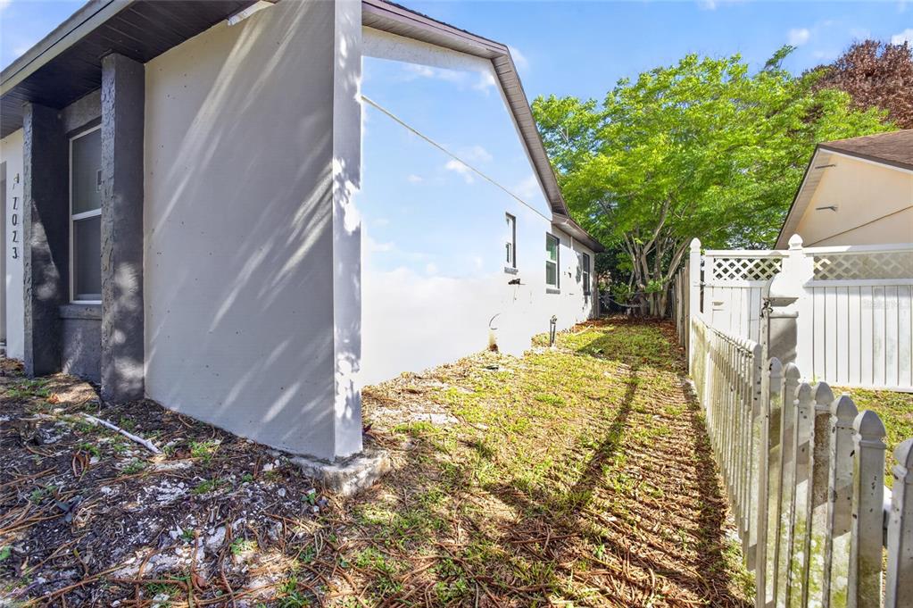 7023 Talbot Drive Orlando, FL 32819 - Photo 33 of 34 a view of a house with a small yard