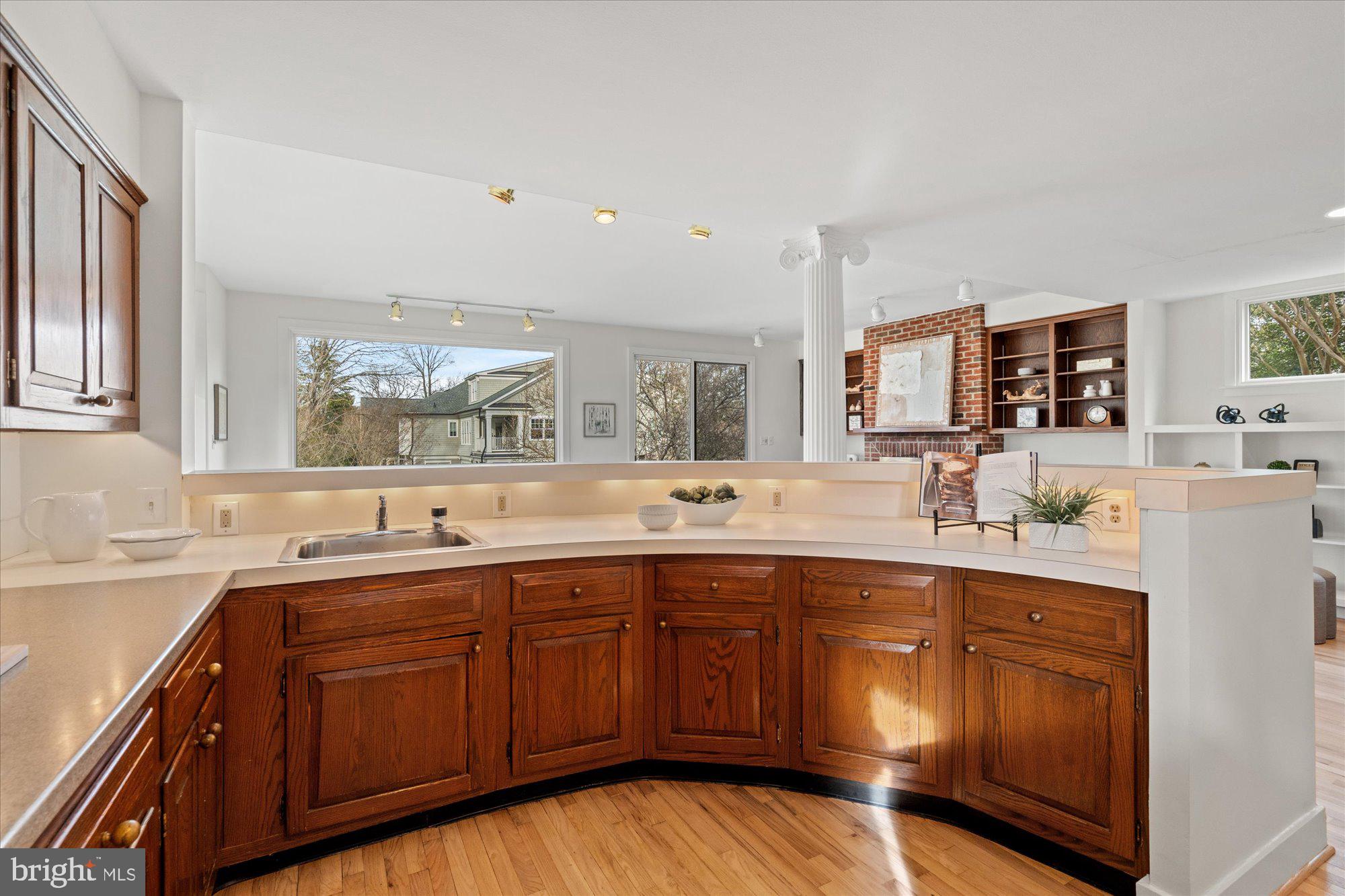 3803 Taylor Street Chevy Chase, MD 20815 - Photo 13 of 35 a kitchen with a sink stove and cabinets